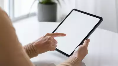 User submitting online form on tablet
